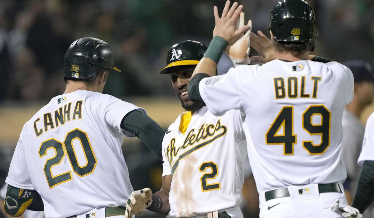A's pound Astros 14-2, keep slim playoff hopes alive